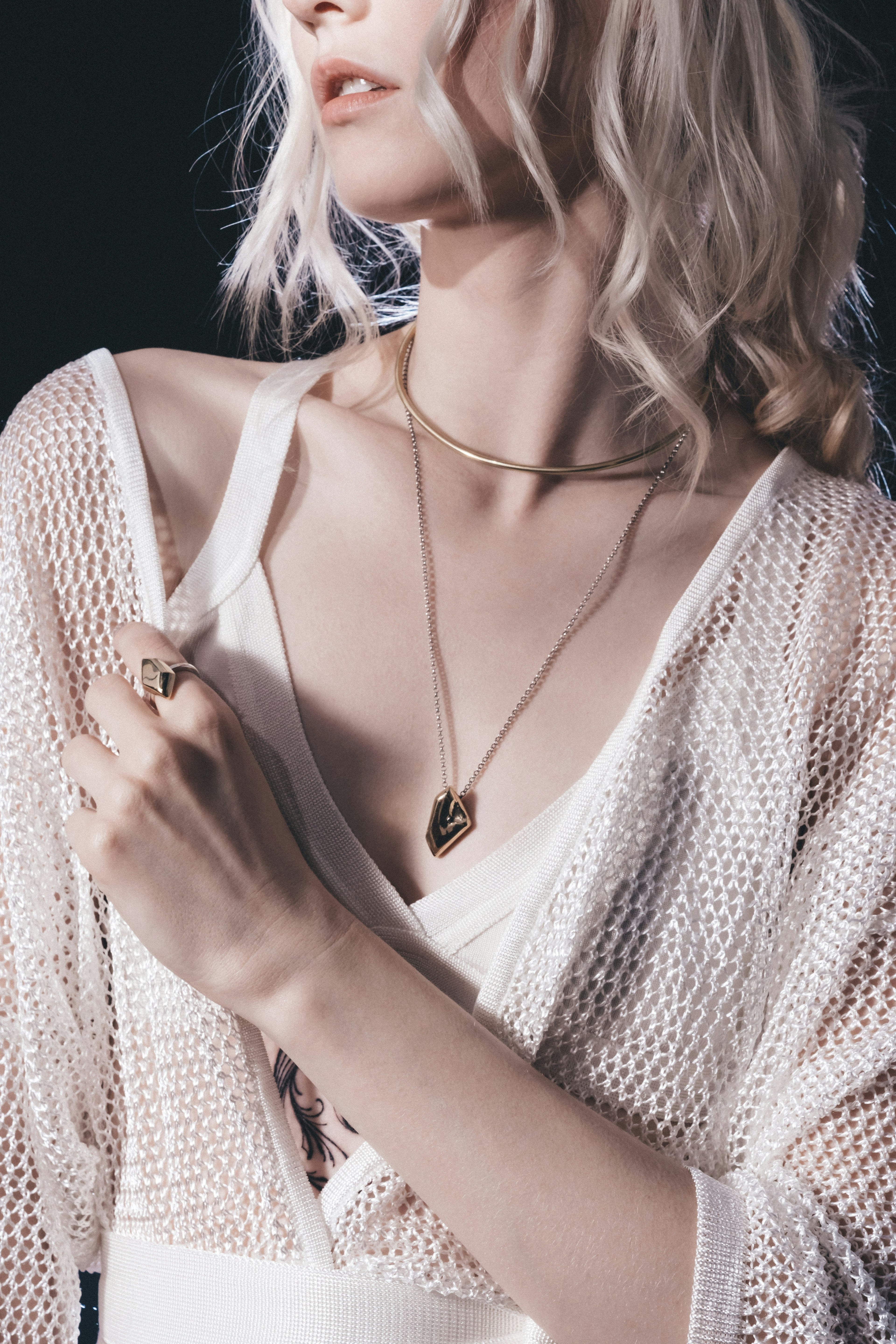Elegant gold pendant necklace collection on luxury dark background