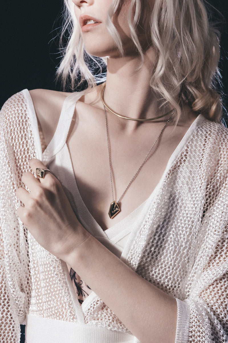 Elegant gold pendant necklace collection on luxury dark background